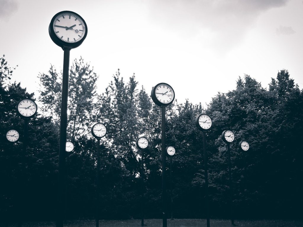 a series of clocks in the park