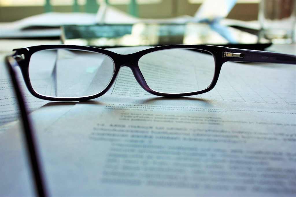 glasses on documents representing summary judgment