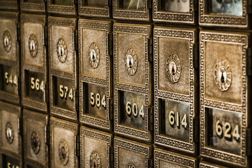 Close-up view of vintage safety deposit banking boxes, representing high-asset divorce, family trusts, and property division in Ontario