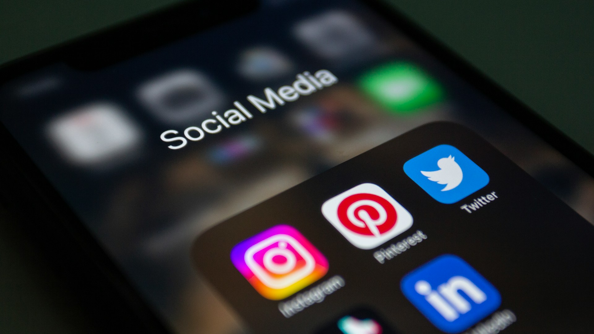 A close up of a phone's screen and its social media aps, representing social media and divorce in Ontario.