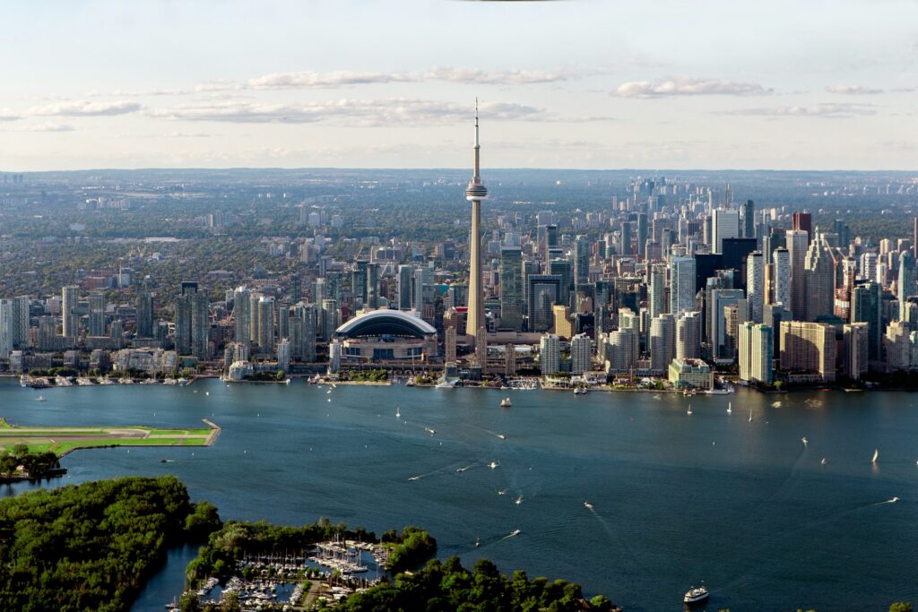 The Toronto skyline, showing The CN Tower, Rogers Centre, office building, and Lake Ontario, representing The 2027 Best Lawyers in Canada.